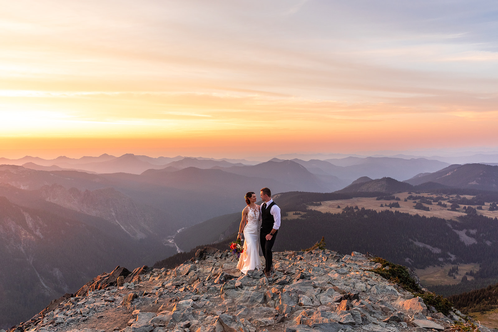 Couple looking at each other on their elopement day at Mount Rainier National Park in Washington